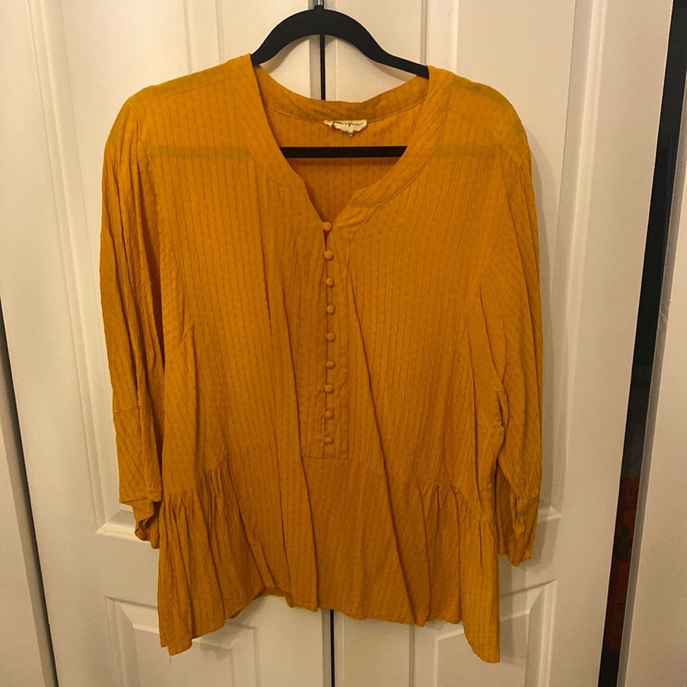 Pumpkin colored peplum top